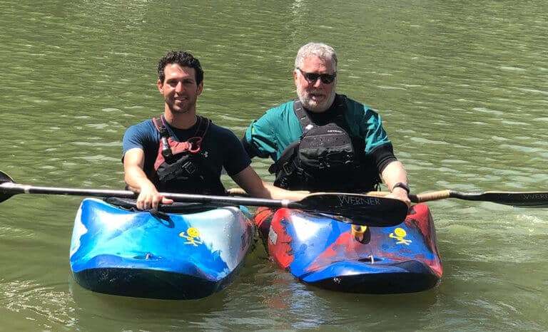 two men in kayaks