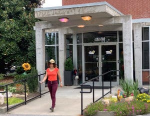 woman walking away from front door