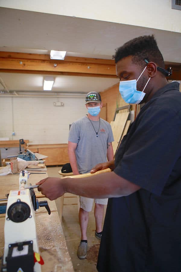 people working in wood shop