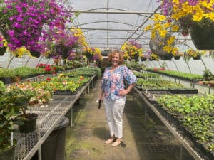 Laurie Rovin in greenhouse