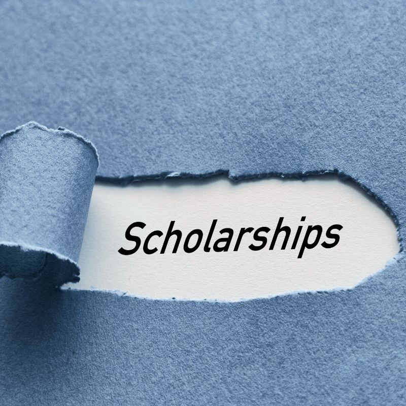 residential mental health scholarship: tearing away paper to discover underneath the word "scholarships"