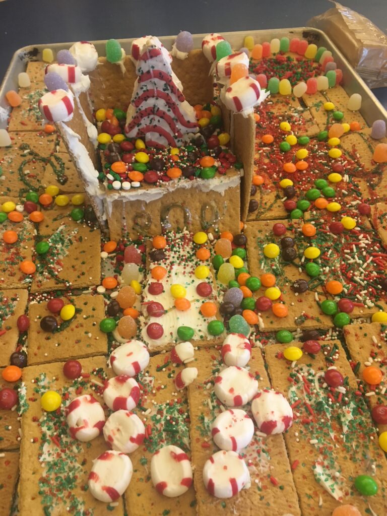 Very festive, decorative gingerbread house. Messy, but lovely.